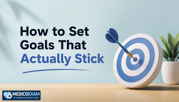 “How to Set Goals That Actually Stick” beside a blue-and-white target with a dart hitting the center, set on a minimalist desk with a small plant in the background.